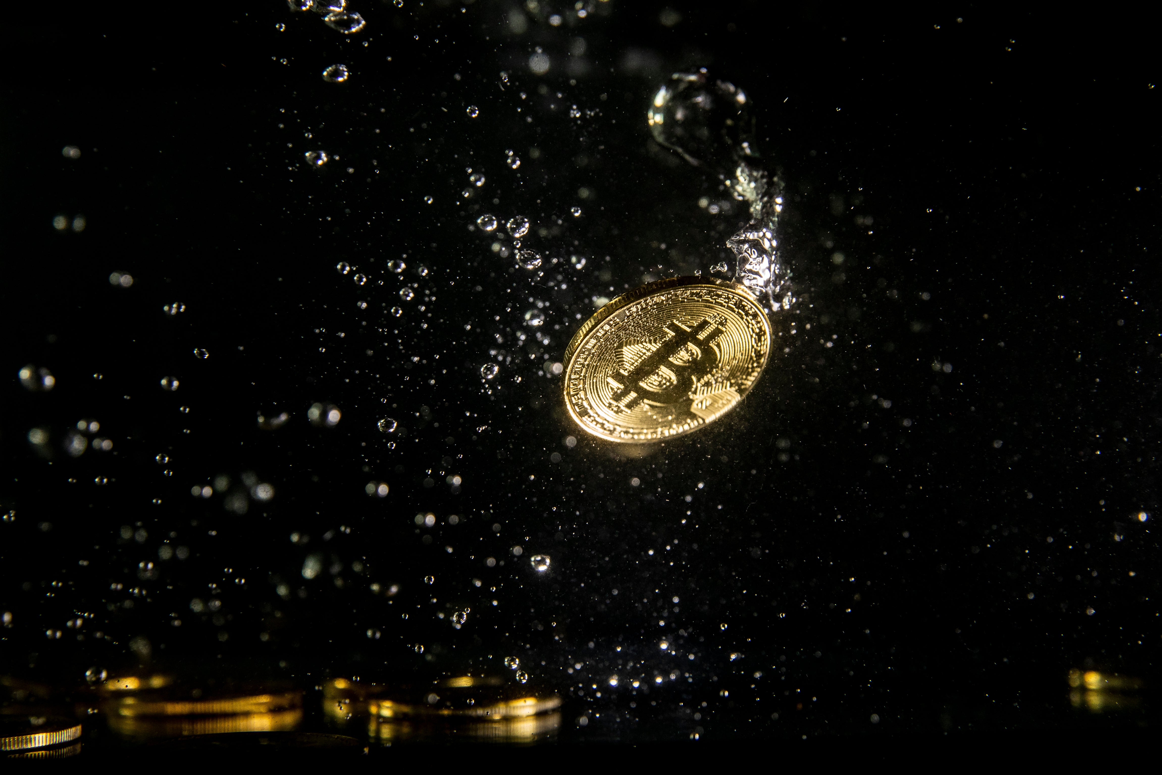 A visual representation of the digital currency Bitcoin sinking into water on 15 August, 2018 in London, England