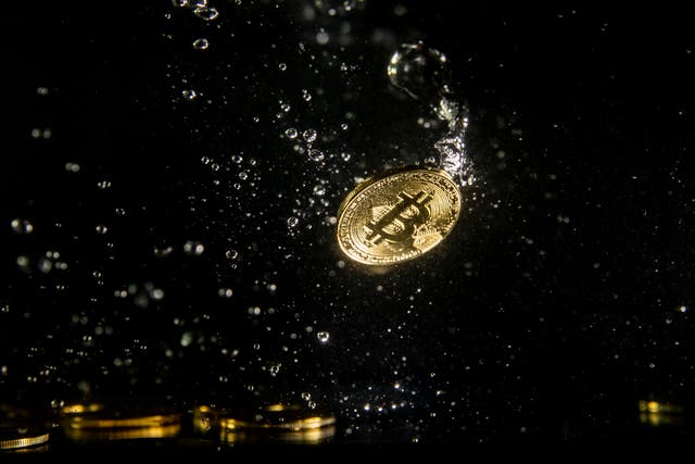 <p>A visual representation of the digital currency Bitcoin sinking into water on 15 August, 2018 in London, England</p>