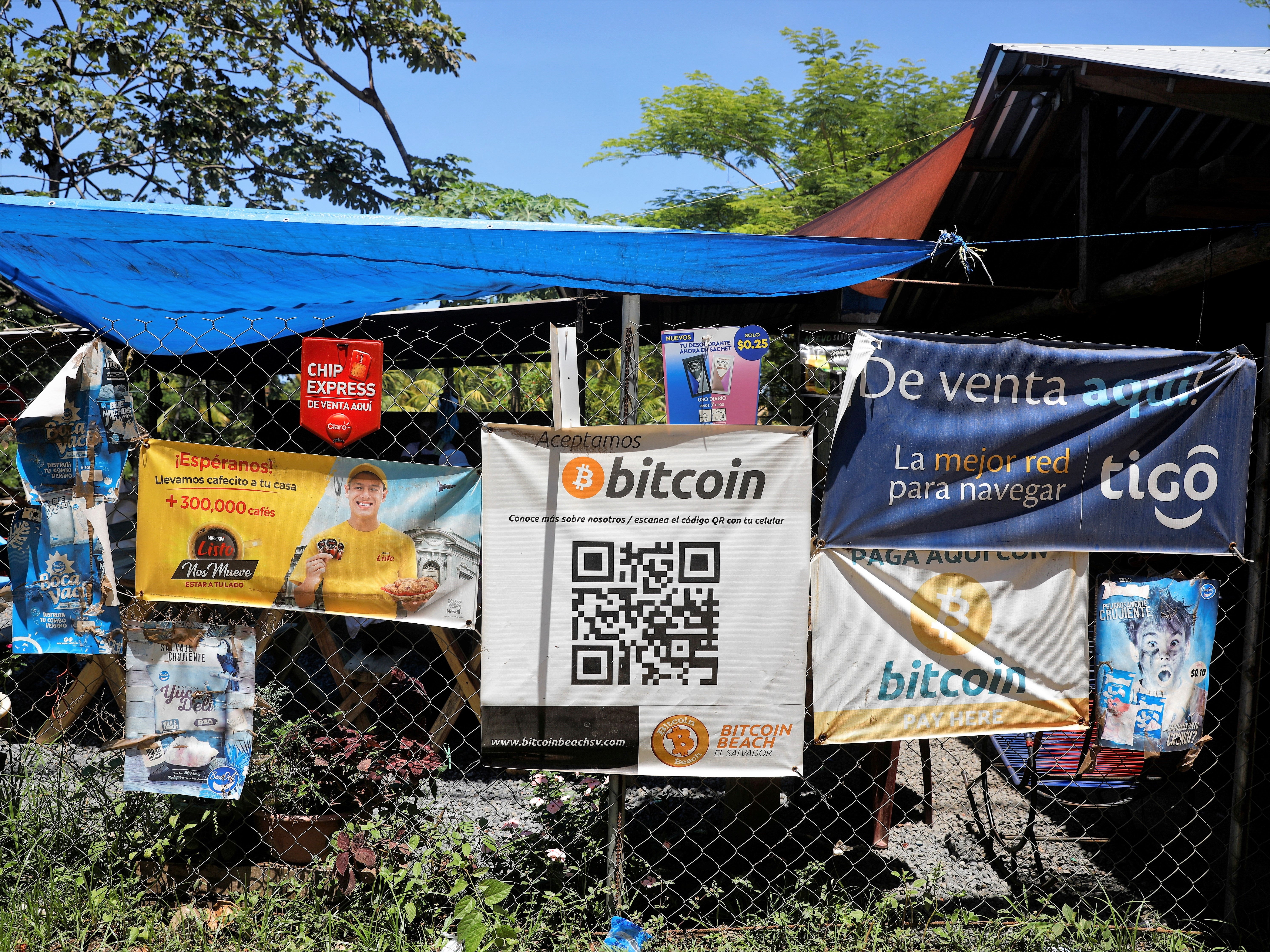 <p>Bitcoin banners are seen outside of a small restaurant at El Zonte Beach in Chiltiupan, El Salvador 8 June, 2021</p>