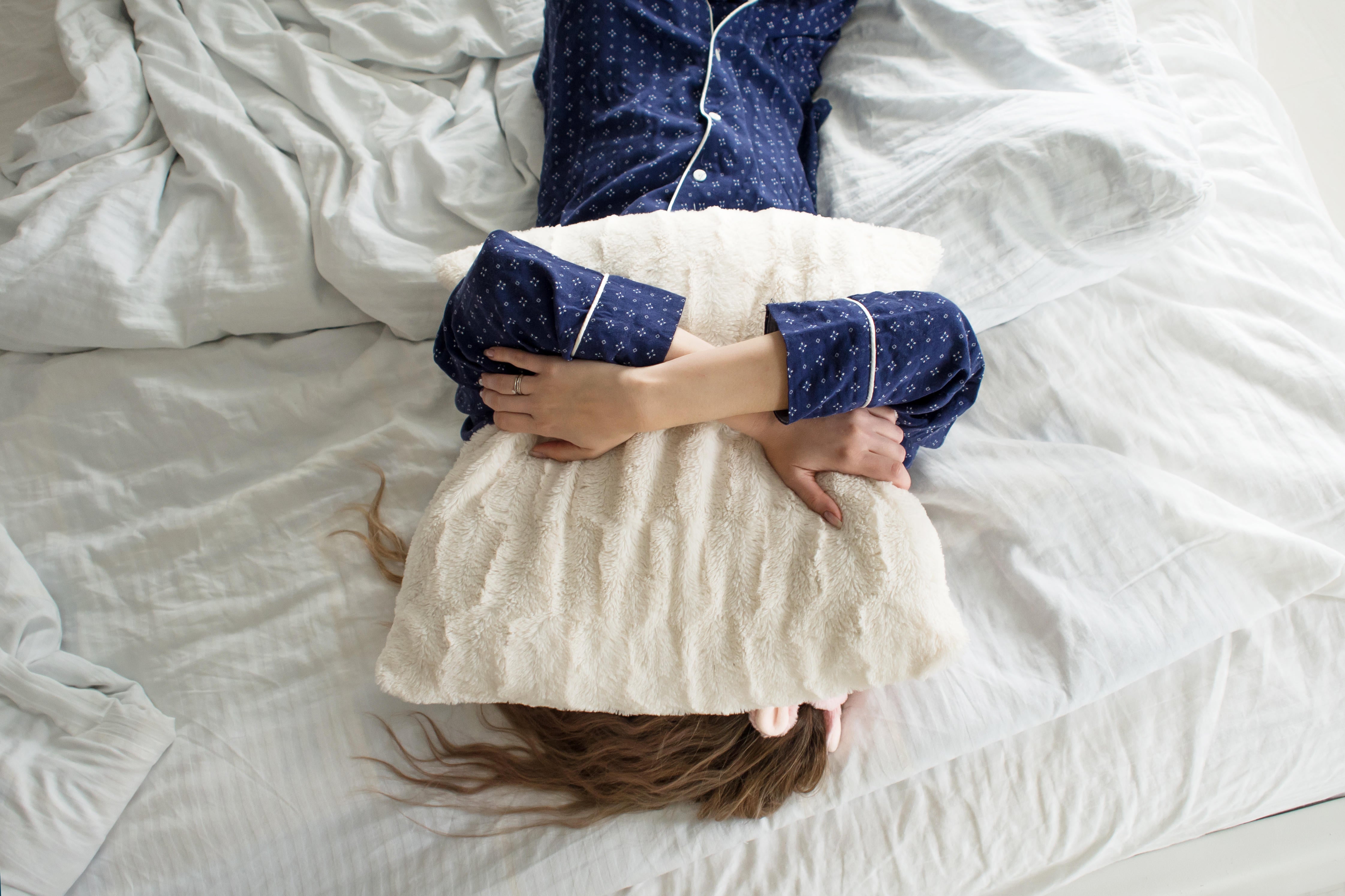 Tired woman in bed