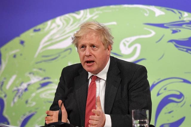 <p>Boris Johnson speaks during the opening session of the virtual Leaders’ Summit on Climate from Downing Street in April</p>