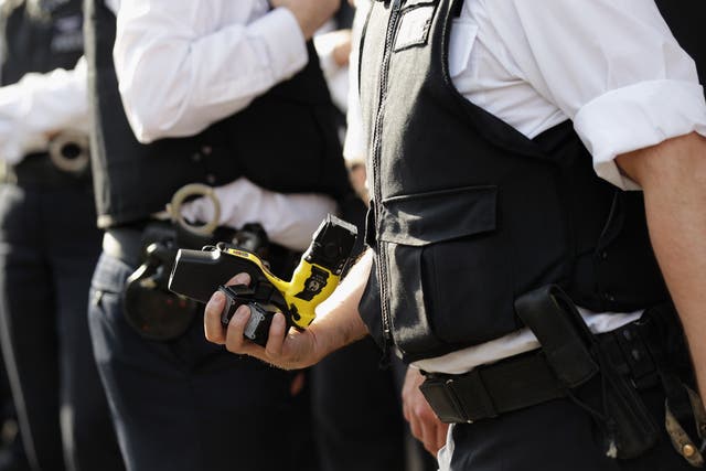 <p>Police police officers are carrying Tasers than ever before in England and Wales </p>