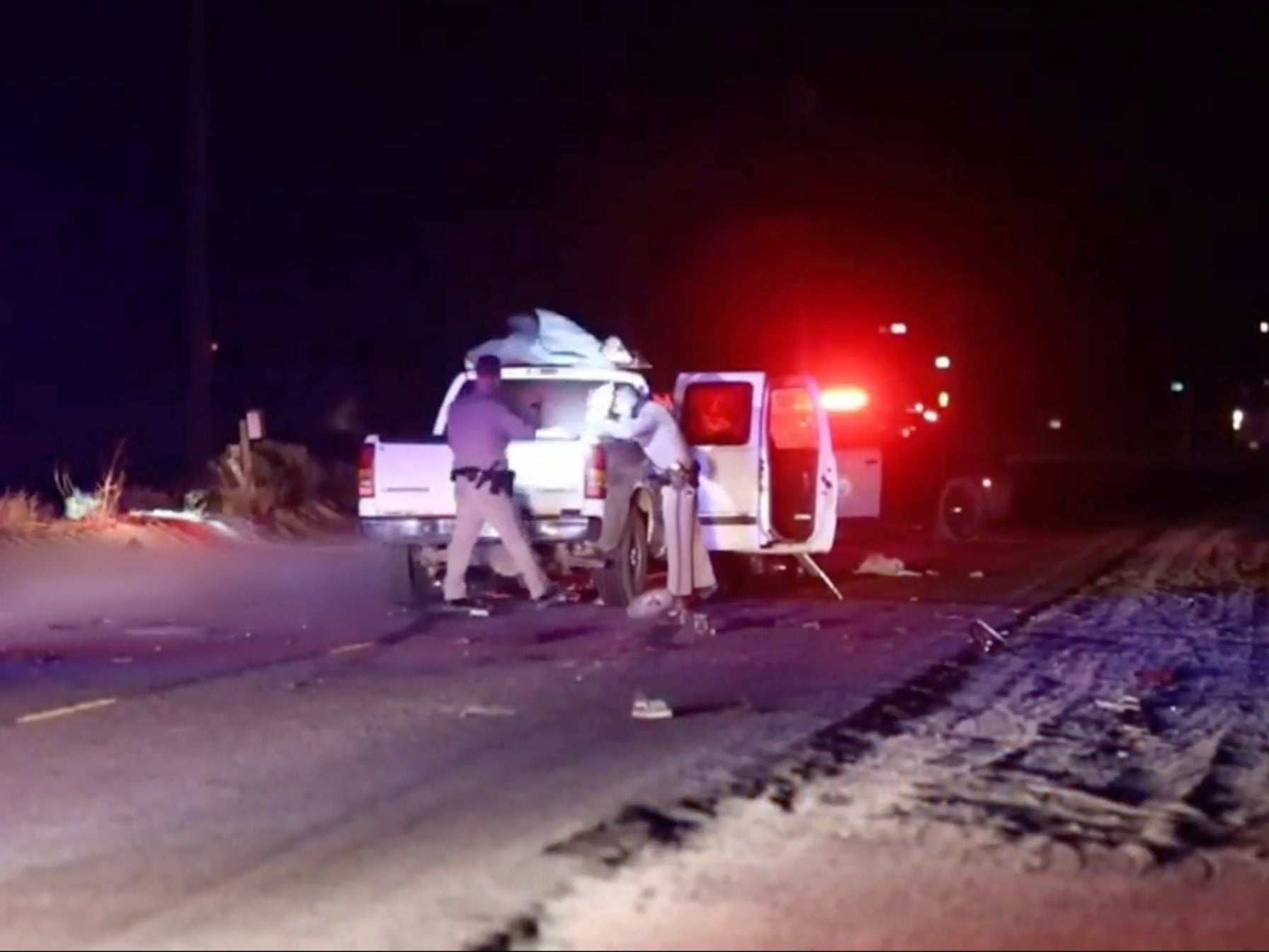 <p>Debris was strewn around the truck of a hit and run suspect who crashed into four girls, three of whom died. </p>