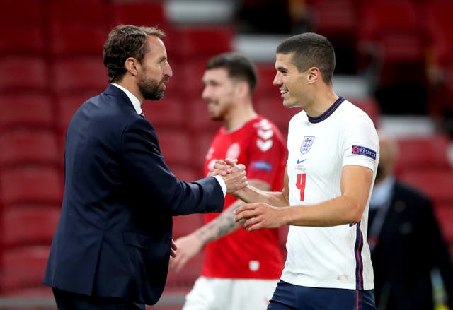 <p>Gareth Southgate shakes hands with Conor Coady</p>