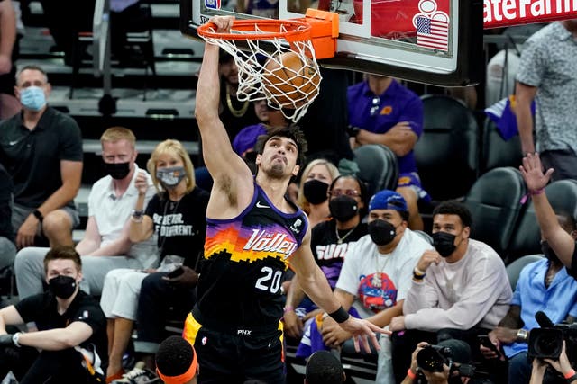Phoenix Suns forward Dario Saric dunks against the Denver Nuggets during the first half