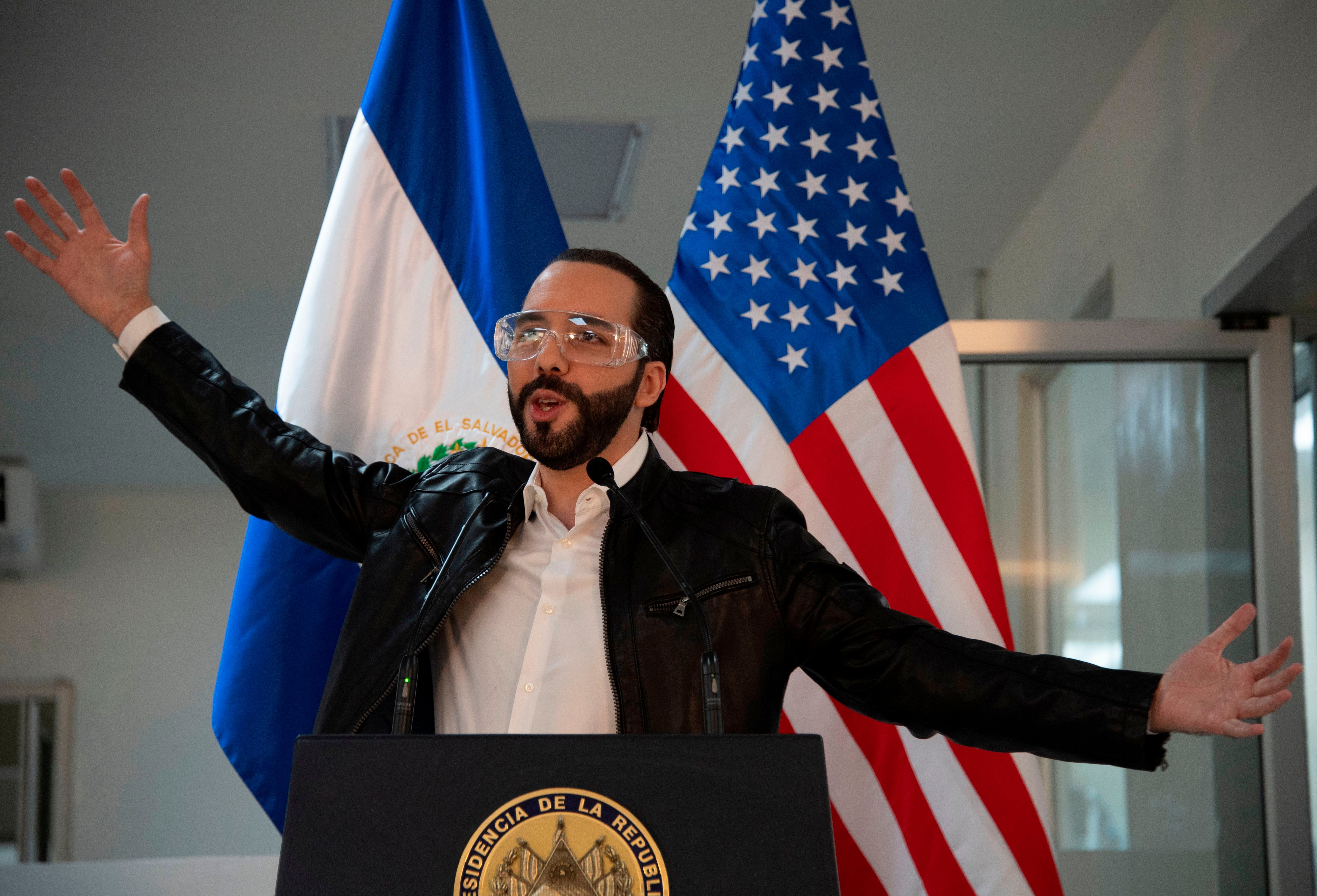 El Salvador’s president Nayib Bukele, accompanied by US Ambassador to El Salvador Ronald Johnson (out of frame), speaks during a joint press conference at Rosales Hospital in San Salvador