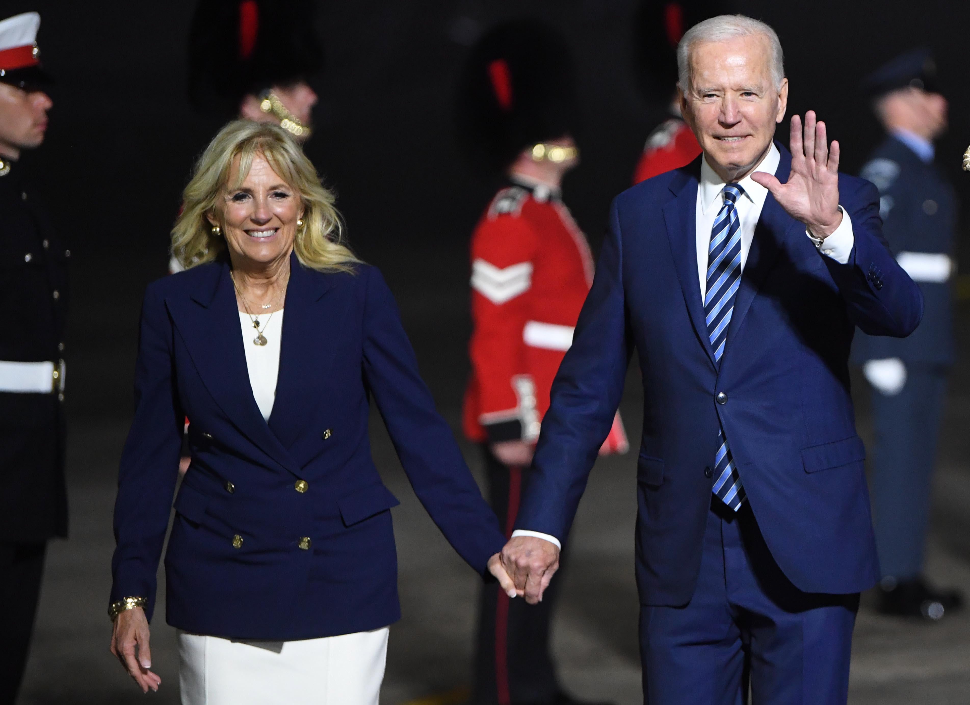 Joe Biden and First Lady Jill Biden (left) arrive in Cornwall