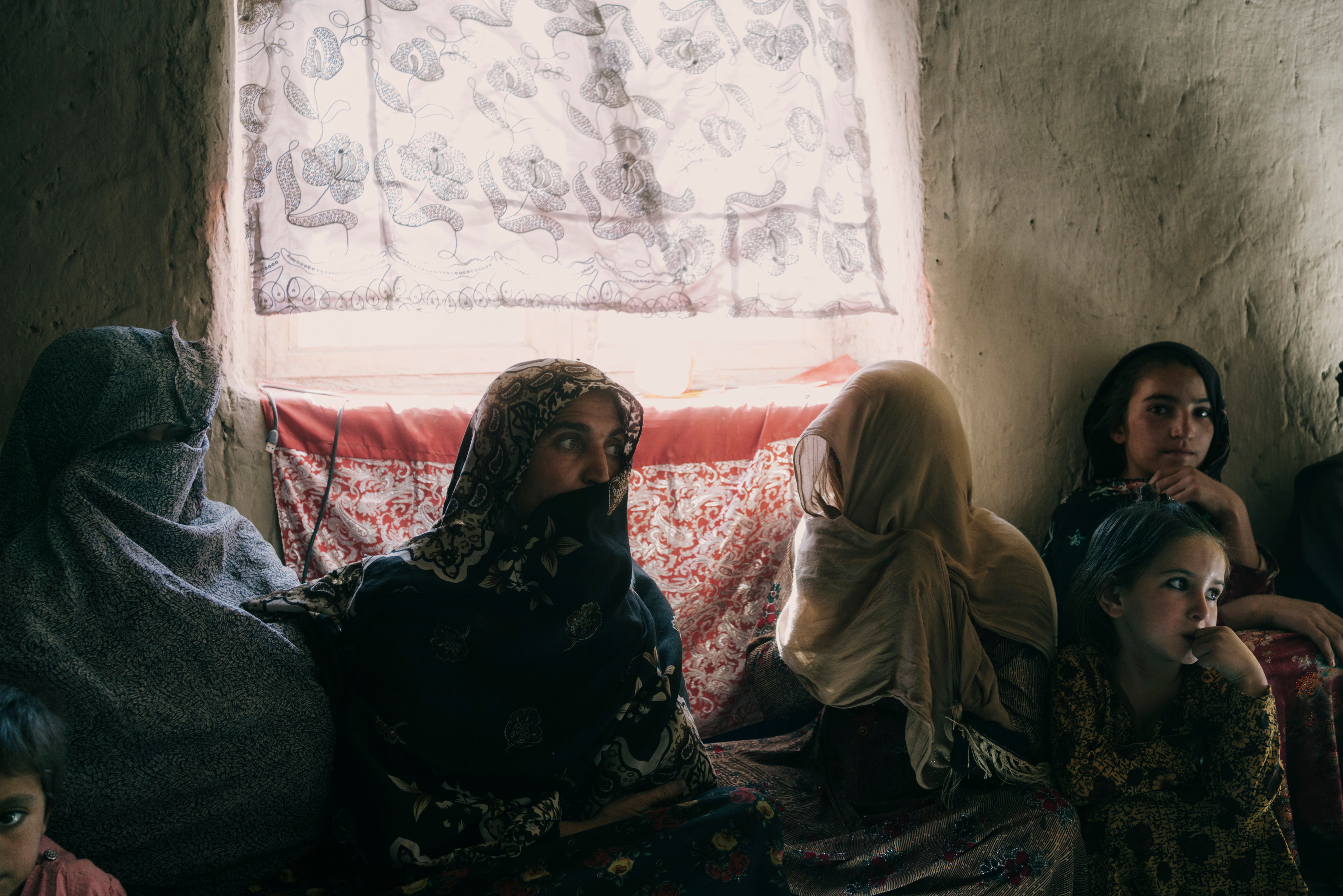 The family of Tajbib hears the sounds of fighting in Lashkar Gah