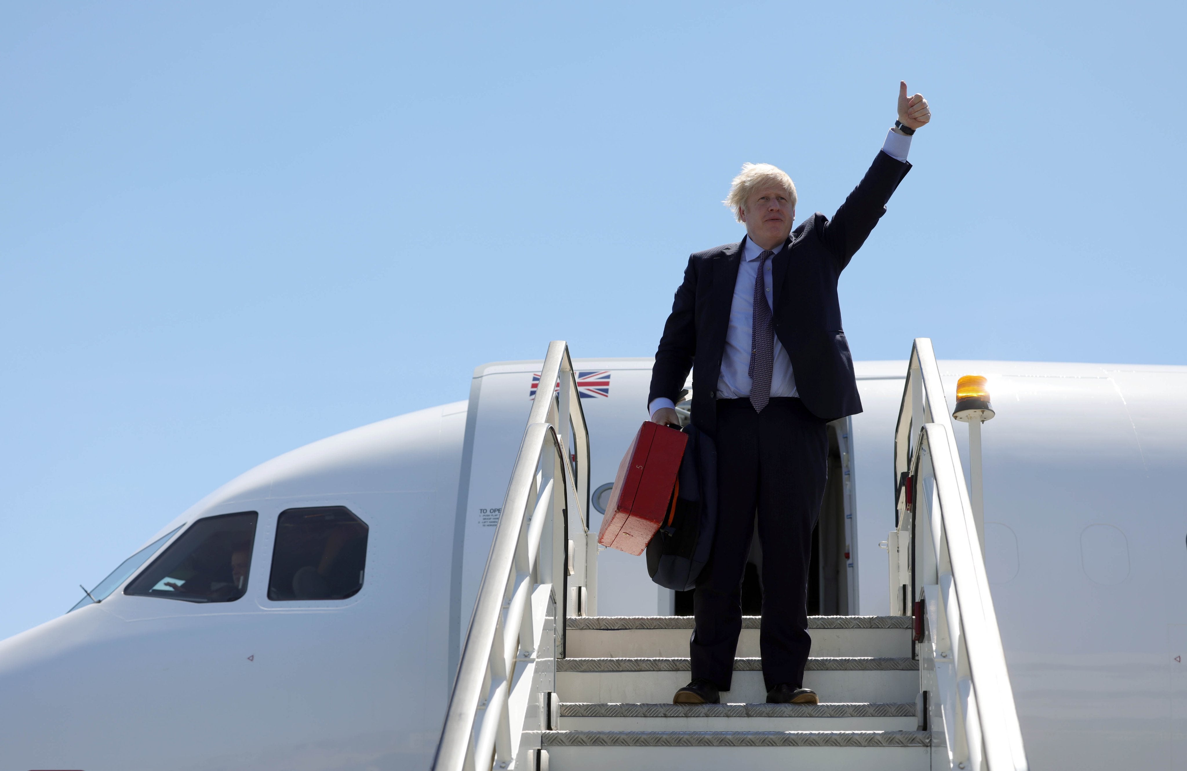 Boris Johnson stepping off a plane on Wednesday night in Cornwall