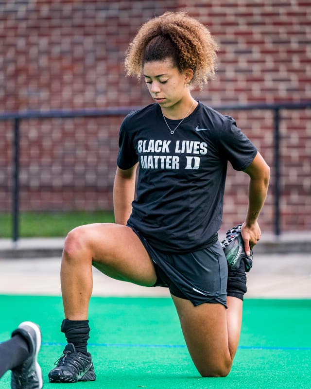 England Under-21 hockey player Darcy Bourne takes the knee wearing a Black Lives Matter T-shirt