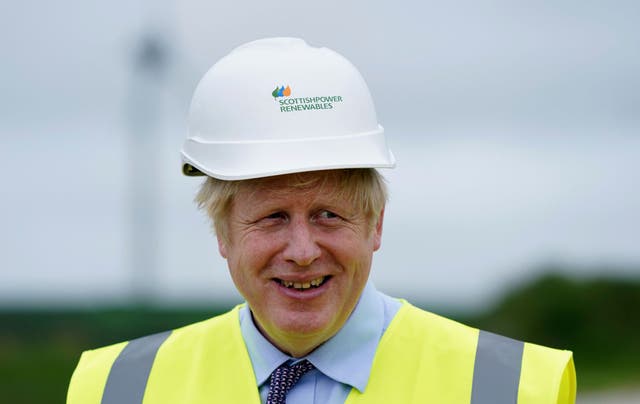 <p>Boris Johnson visits the Scottish Power Carland Cross Windfarm on 9 June</p>