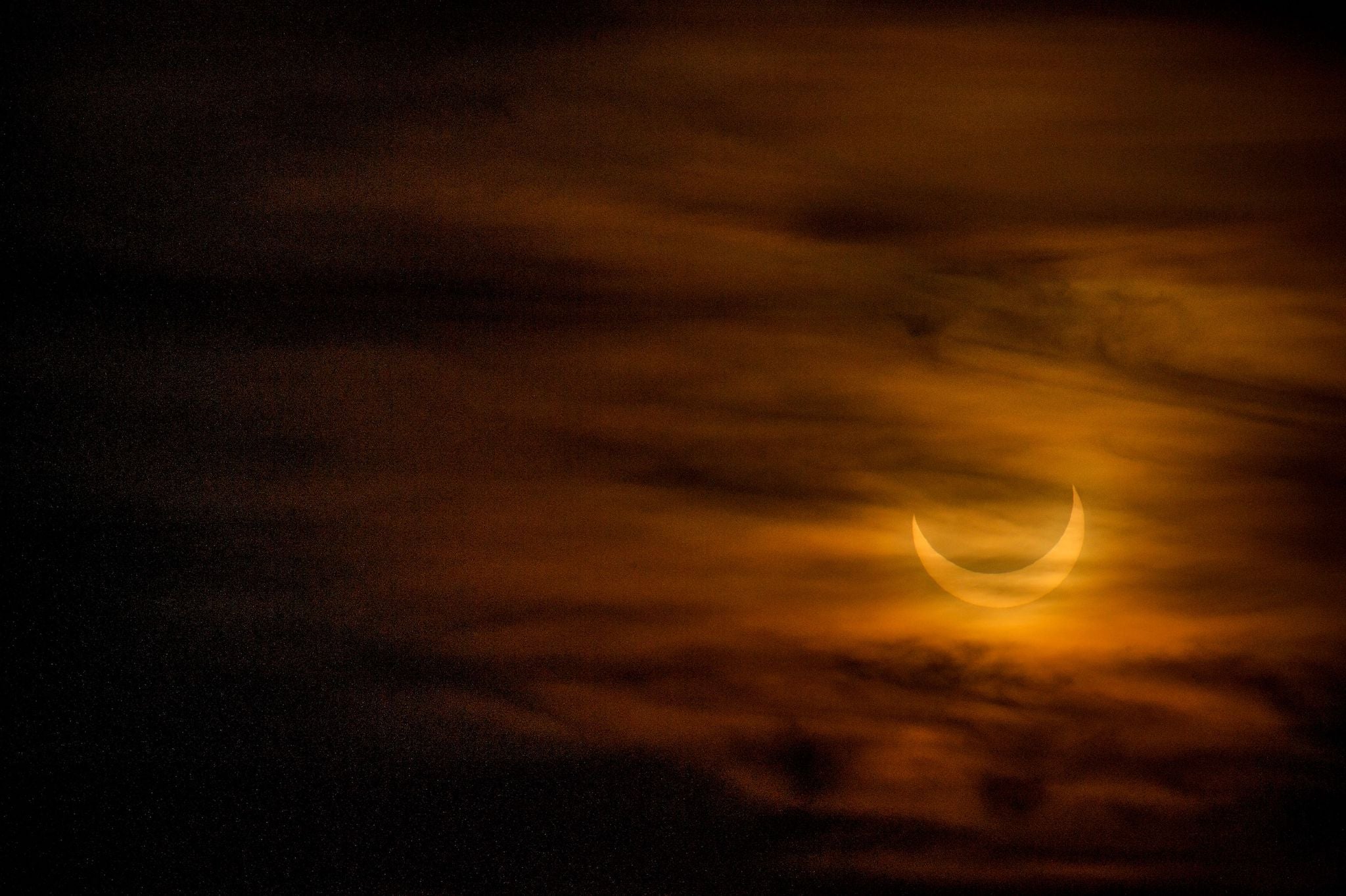 A annular eclipse is seen as the sun rises over Scituate, Massachusetts