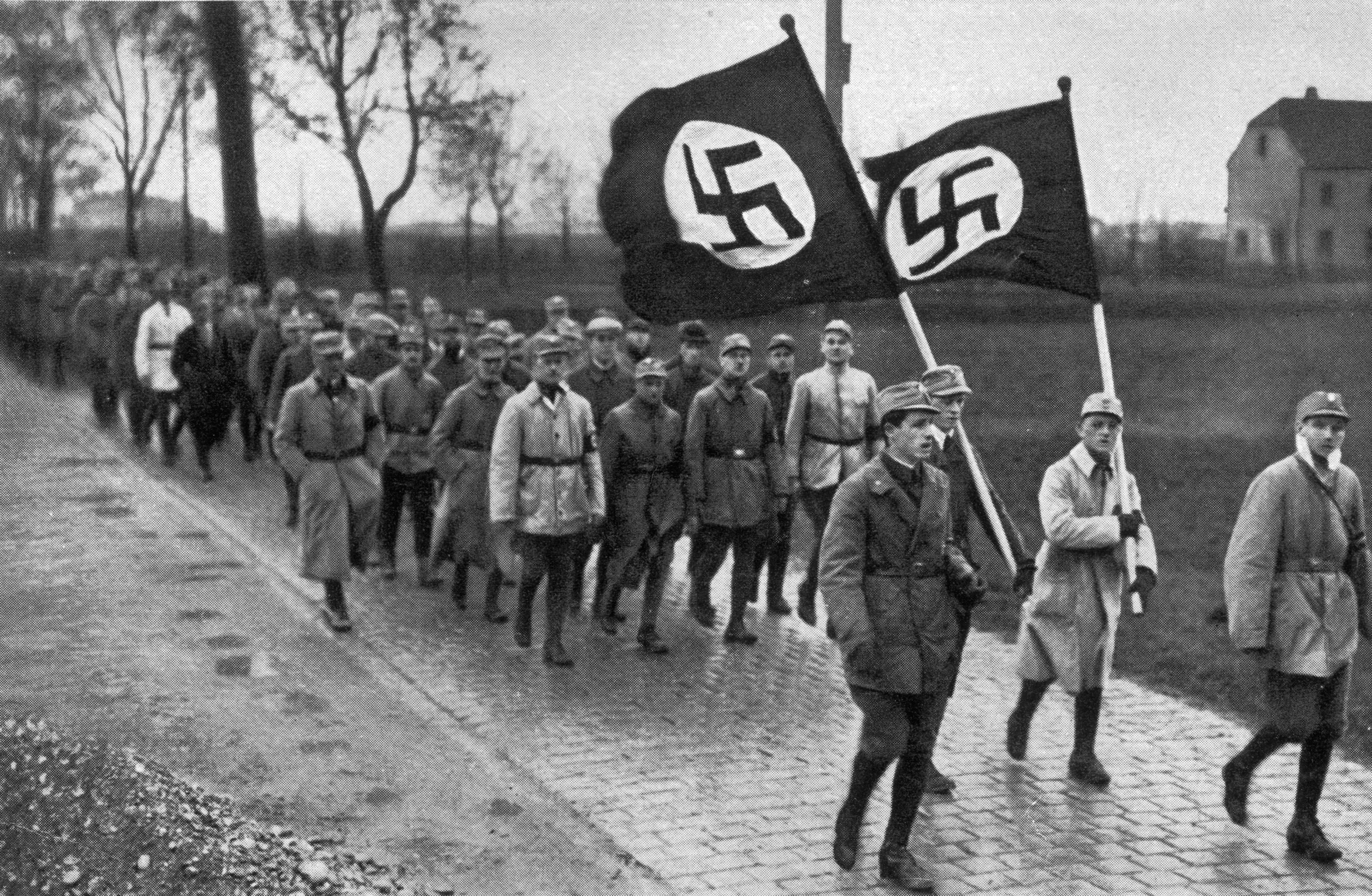 1923: members of the SA, the paramilitary wing of the Nazi Party, during a training march outside Munich