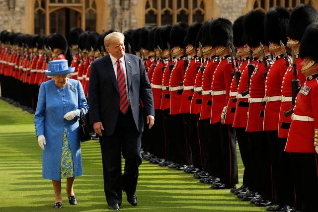 <p>The Queen inspects a guard of honour with Donald Trump in 2018</p>
