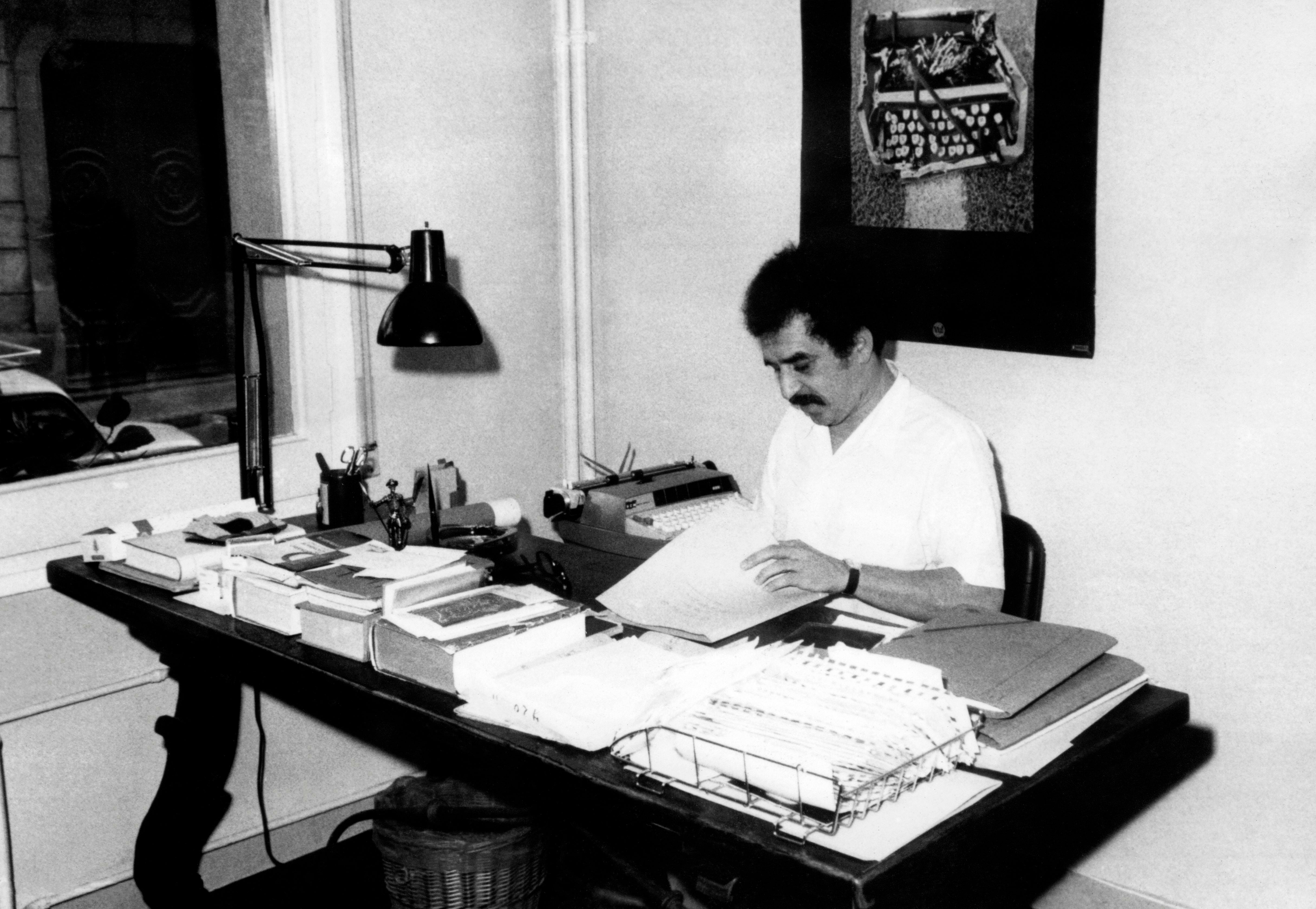 Gabriel Garcia Marquez writing at his home in Barcelona circa 1970