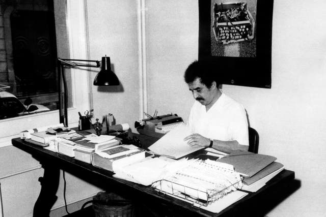 <p>Gabriel Garcia Marquez writing at his home in Barcelona circa 1970</p>