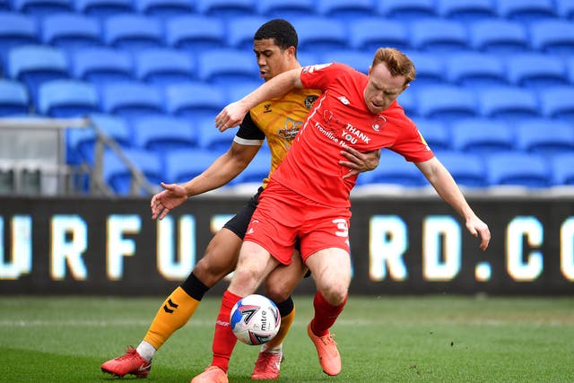 Newport County’s Priestley Farquharson (left) and Leyton Orient’s Danny Johnson battle for the ball during the Sky Bet League Two match at the Cardiff City Stadium, Cardiff.