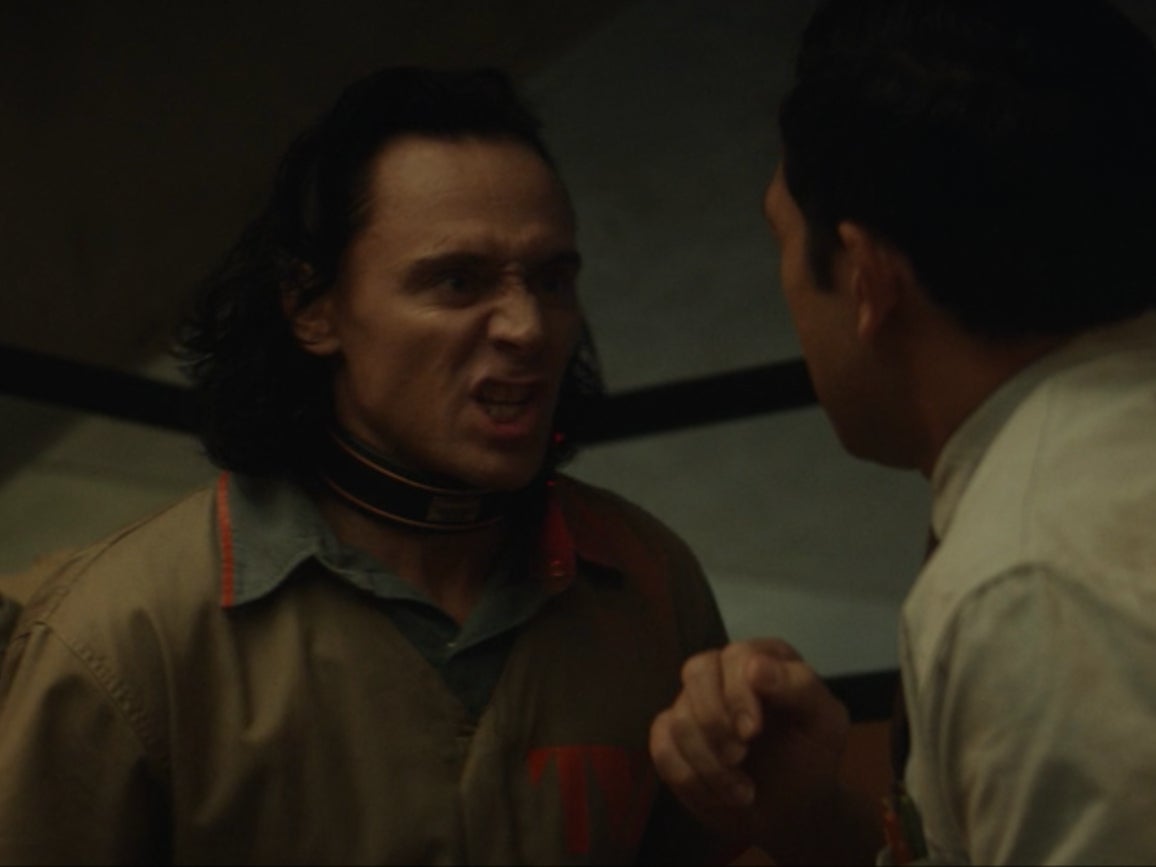 Loki threatens a TVA employee to retrieve the Tesseract