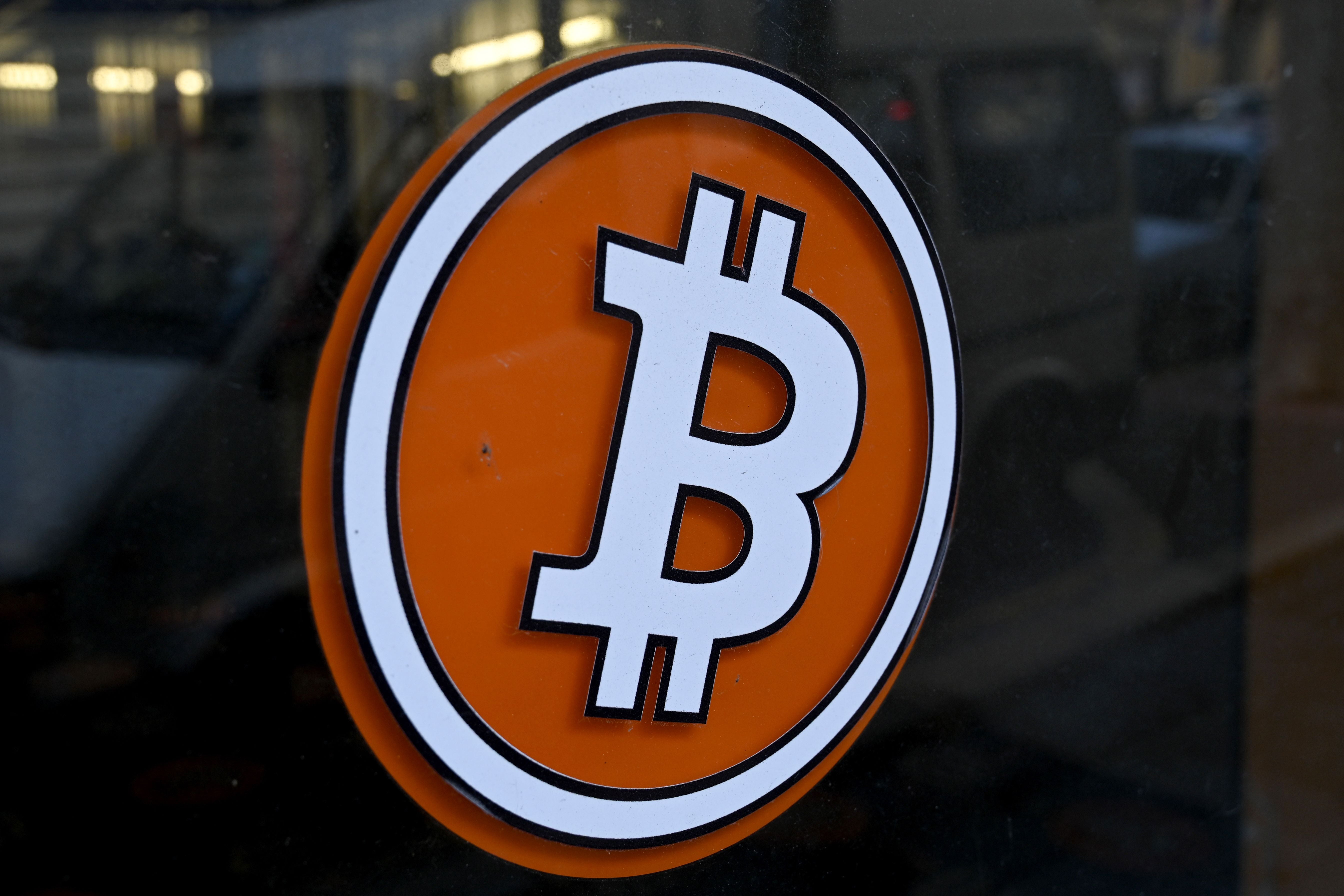 <p>The logo of Bitcoin digital currency is pictured on the front door of an ATM in Marseille, southern France</p>