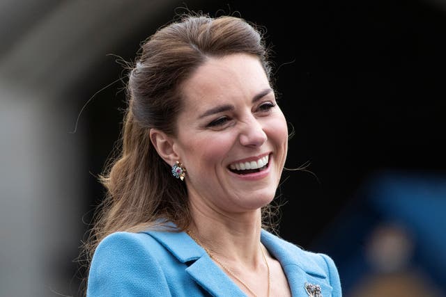 <p>Britain's Catherine, Duchess of Cambridge reacts during a Beating of the Retreat at Holyroodhouse Palace in Edinburgh, Scotland</p>