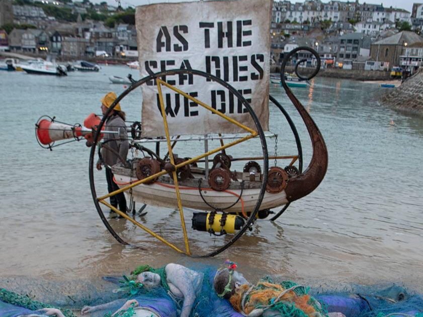 Ocean Rebellion protesters hold a demonstration in St Ives, Cornwall, on Friday, 11 June, to call on G7 leaders to take action to protect the world’s oceans.