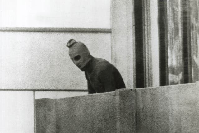 <p>Defining moment: a hooded Palestinian on the balcony above the Israeli athletes </p>