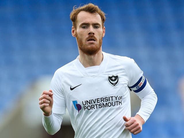 <p>Tom Naylor is to join Wigan after three years at Portsmouth (Barrington Coombs/PA)</p>
