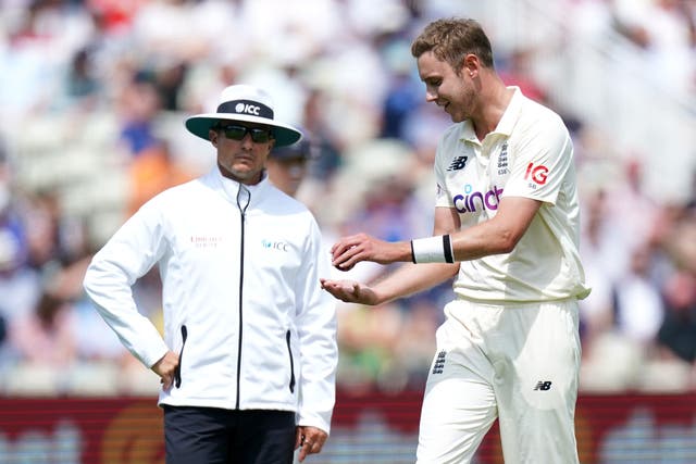 Stuart Broad speaks to the umpires after New Zealand’s Devon Conway was given not out