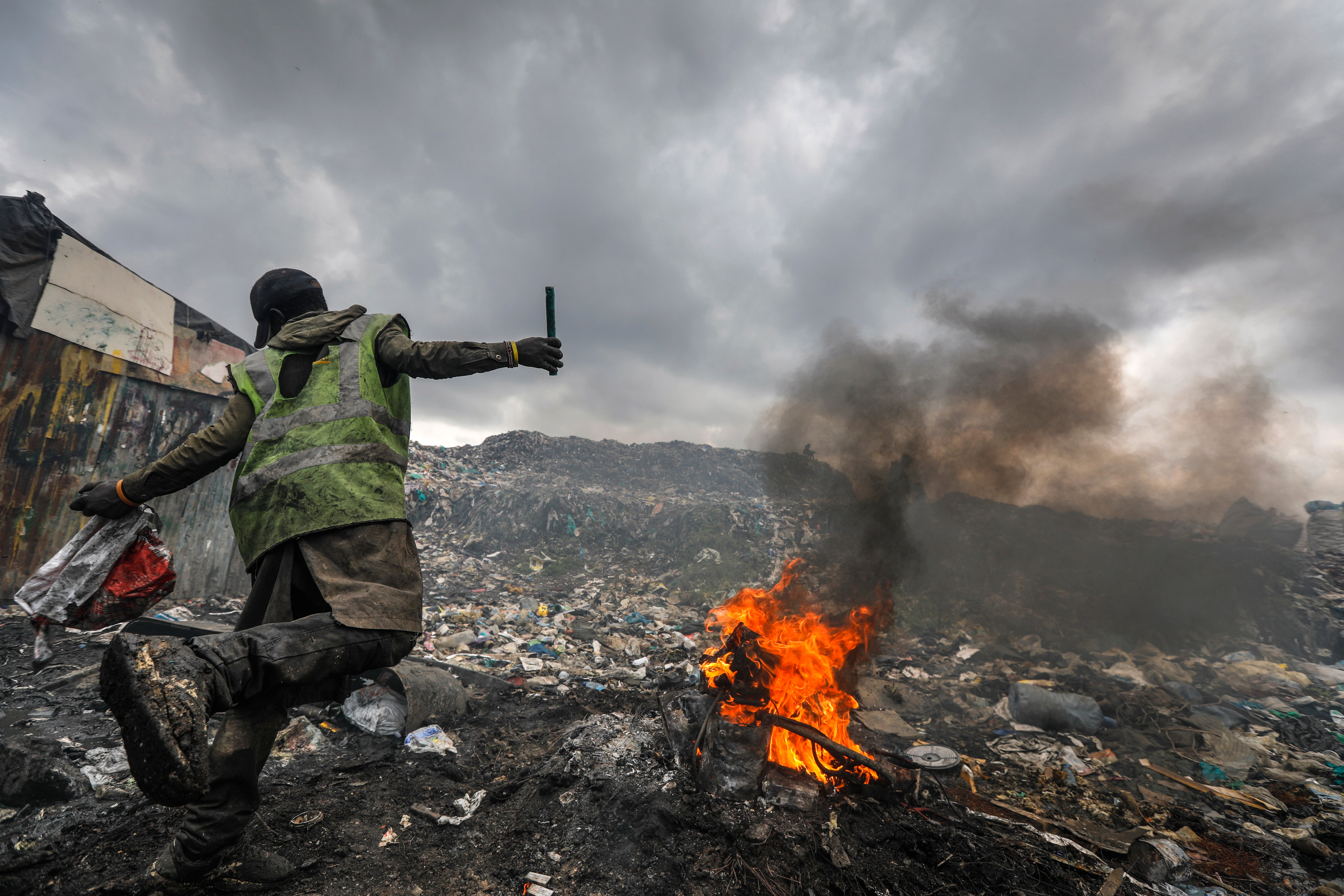 Slum dwellers scavenge for e-waste to sell for a living in a dump in Dandora, Kenya