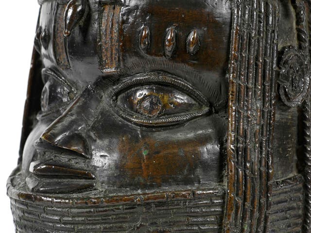 <p>A handout picture taken on March 17, 2021 at the University of Aberdeen shows a bronze sculpture depicting an "Oba" (king) of Benin acquired by the University at auction in 1957</p>