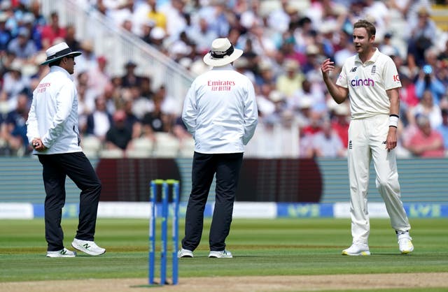 England's Stuart Broad (right) speaks to the umpires