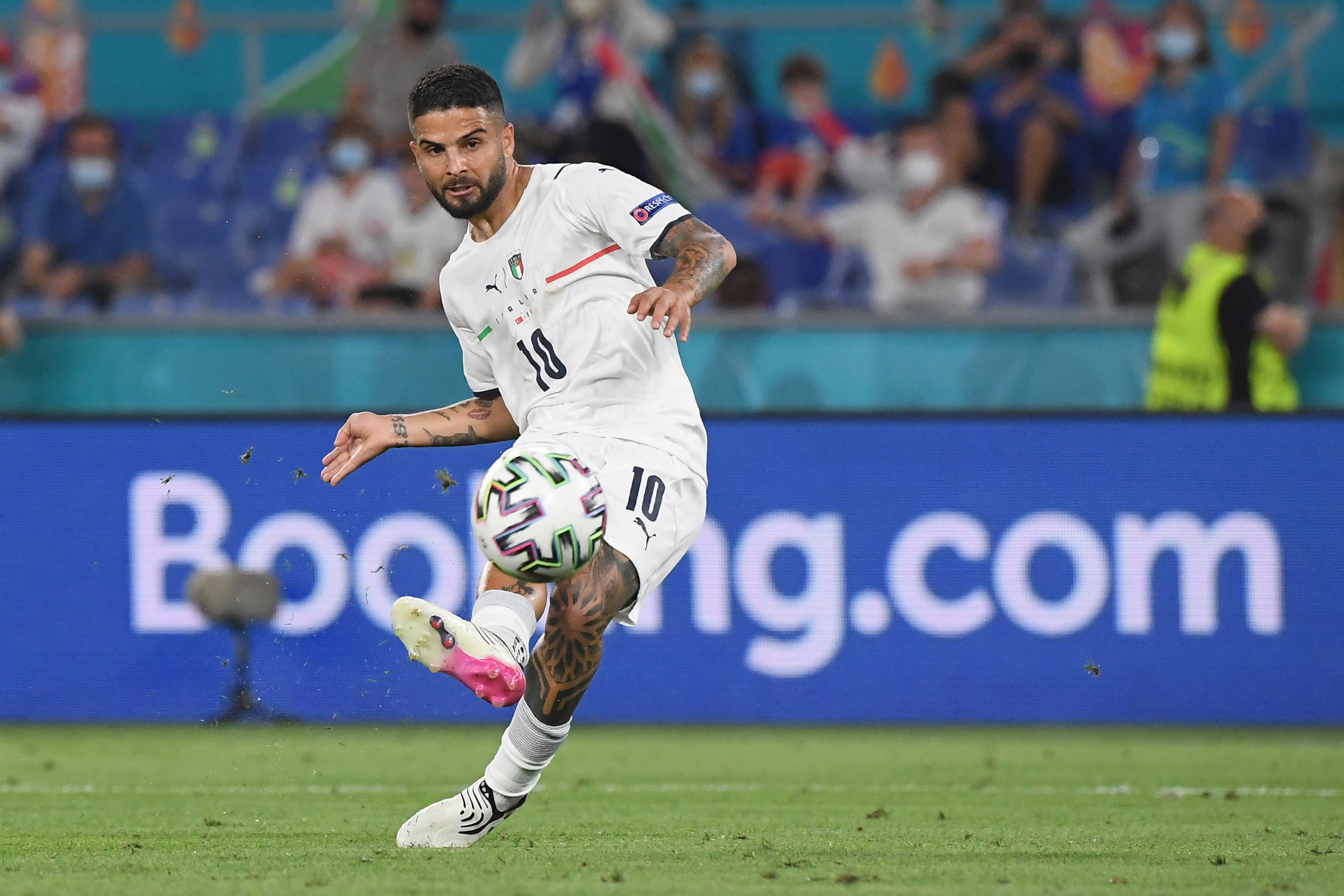 Italy’s Lorenzo Insigne scores his side’s third goal