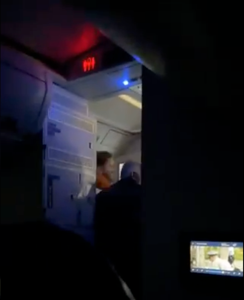 A passenger attempted to open plane door mid-flight