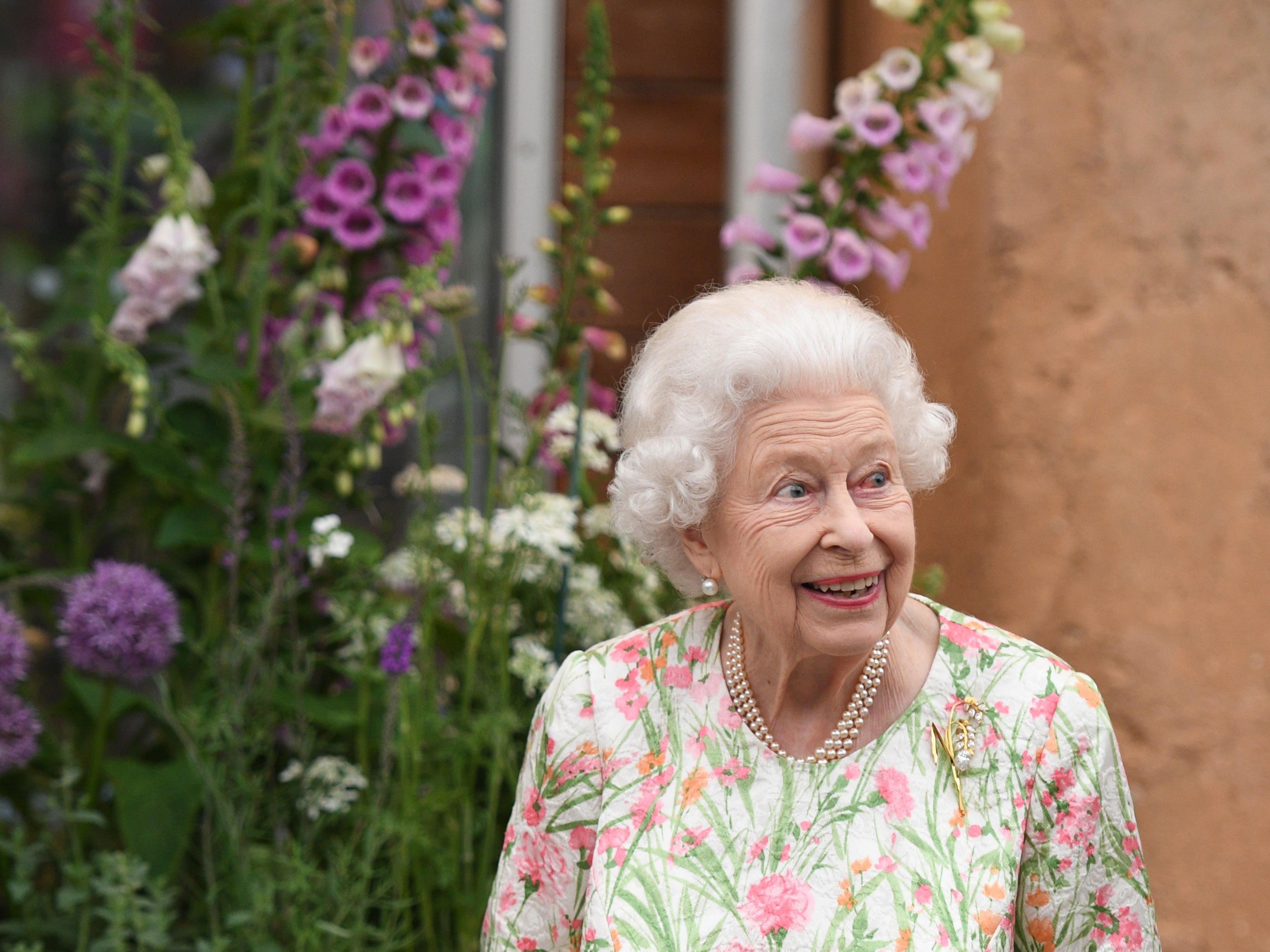 <p> Queen Elizabeth II smiles during the G7 Summit on June 11, 2021</p>