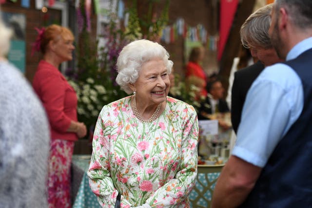 <p>Queen Elizabeth II smiles as she meets people from communities across Cornwall</p>