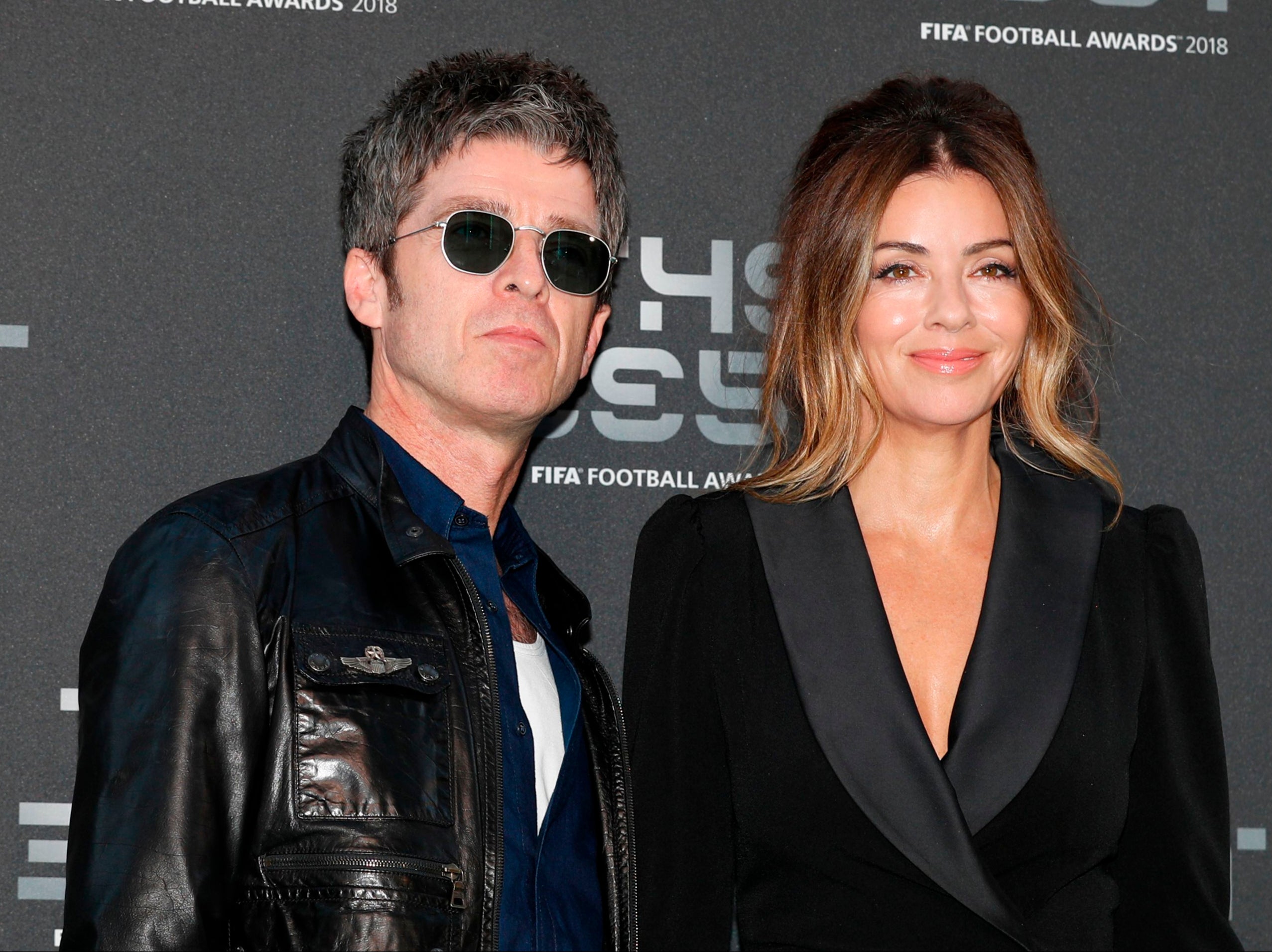 Noel Gallagher with his wife, Sarah MacDonald