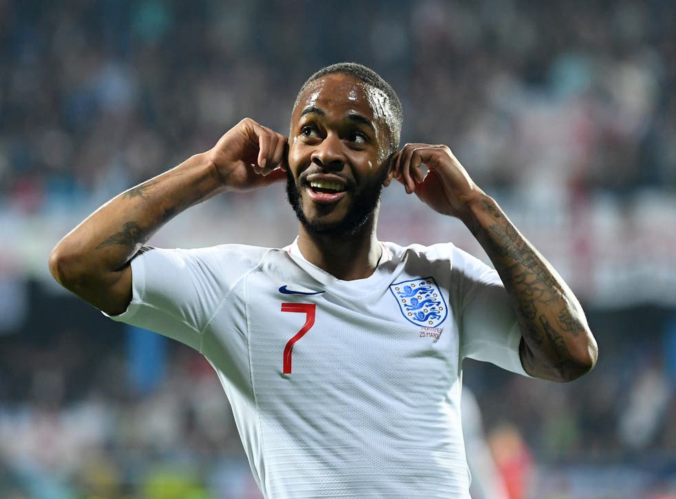 <p>Sterling mocks racist fans after scoring England’s fifth goal during a qualifying match against Montenegro in 2019</p>