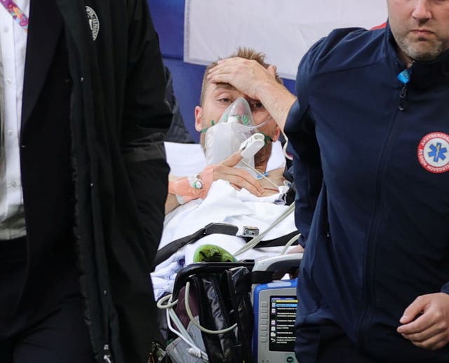 <p>Christian Eriksen is stretchered off the pitch before being taken to hospital</p>