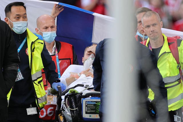<p>Denmark's midfielder Christian Eriksen is evacuated after collapsing on the pitch during the UEFA EURO 2020 Group B football match between Denmark and Finland</p>