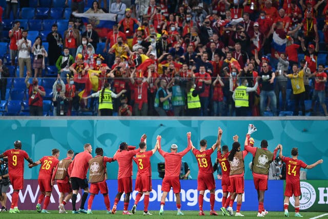 <p>Belgium’s players celebrate with their fans after a 3-0 win over Russia</p>