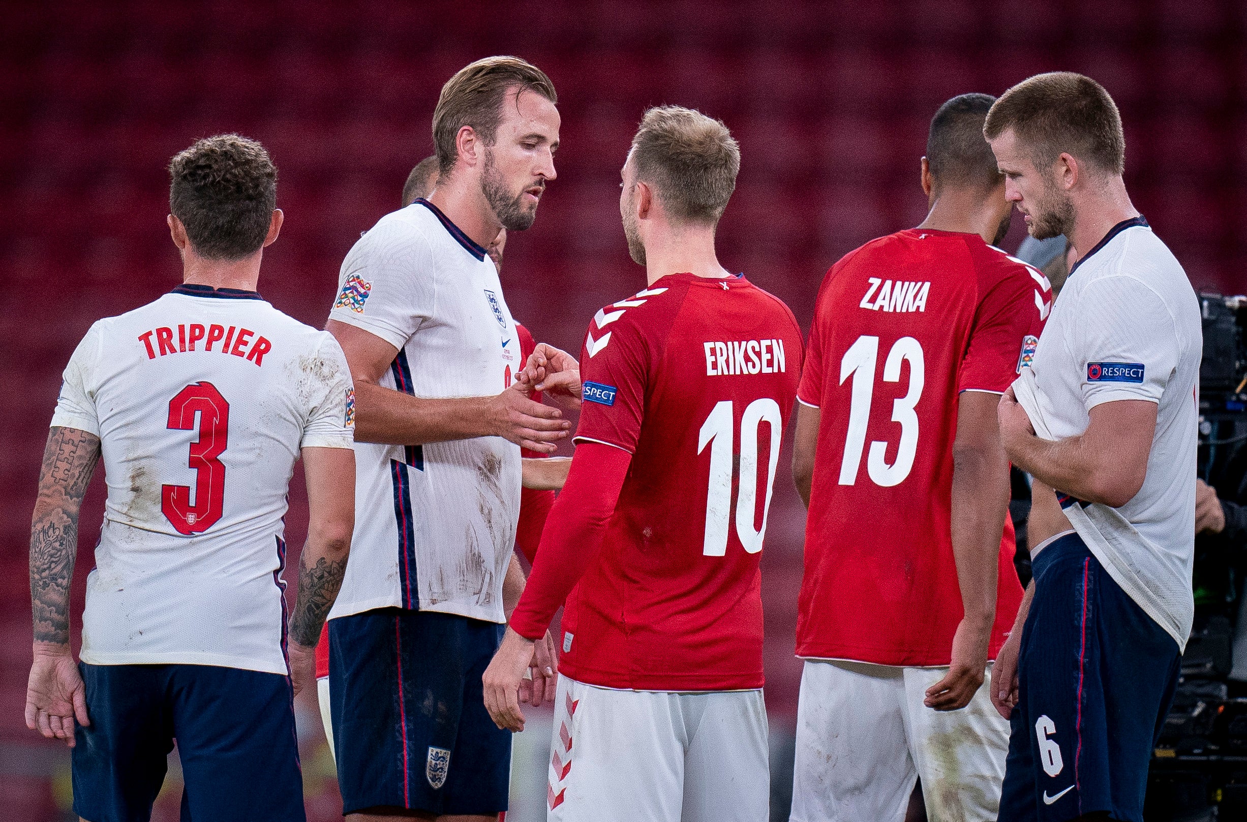 England's forward Harry Kane speaks with Denmark's midfielder Christian Eriksen