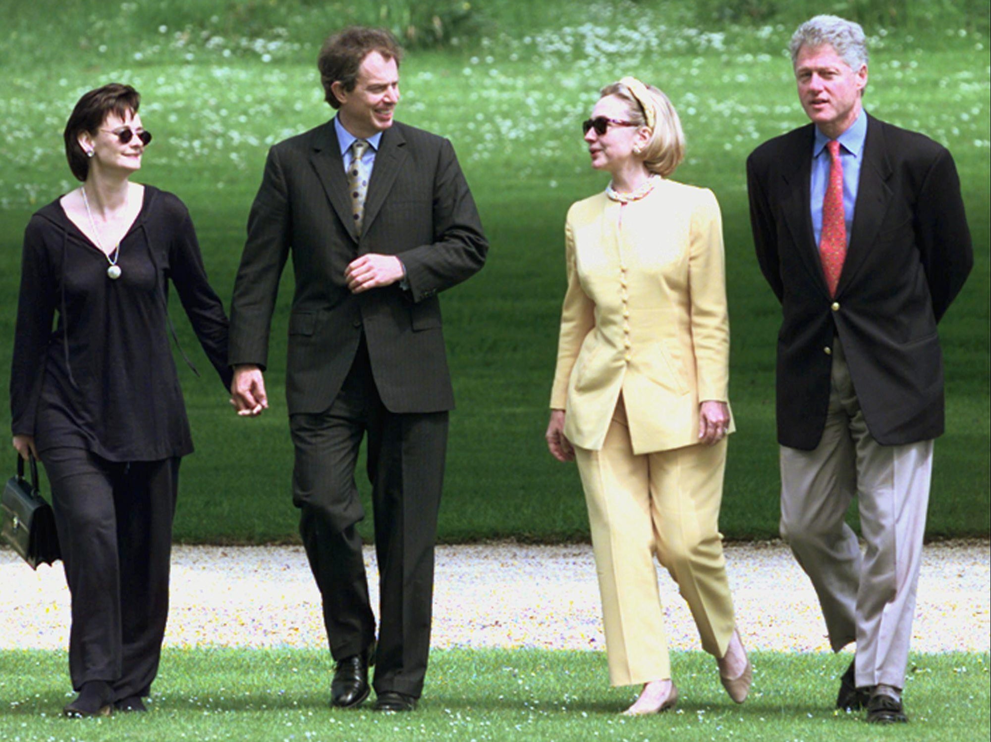Tony Blair and his wife Cherie (L), and Hillary Clinton and Bill Clinton at the G8 summit in 1998