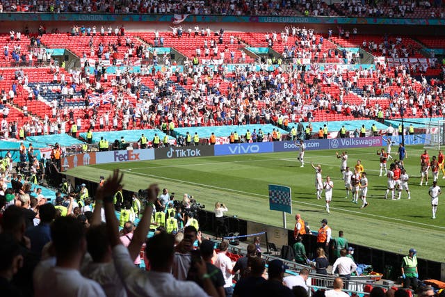 <p>England fans salute their players on a 1-0 win</p>