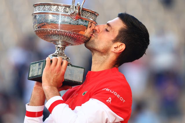 <p>Novak Djokovic with his 19th Grand Slam trophy</p>