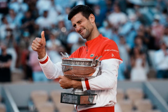 <p>Novak Djokovic gives a thumbs up as he holds the Coupe des Mousquetaires</p>