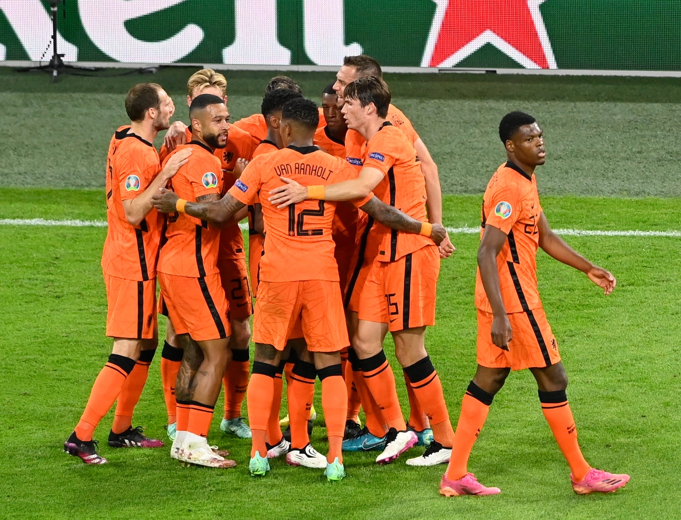 Holland's players celebrate after scoring a second goal against Ukraine