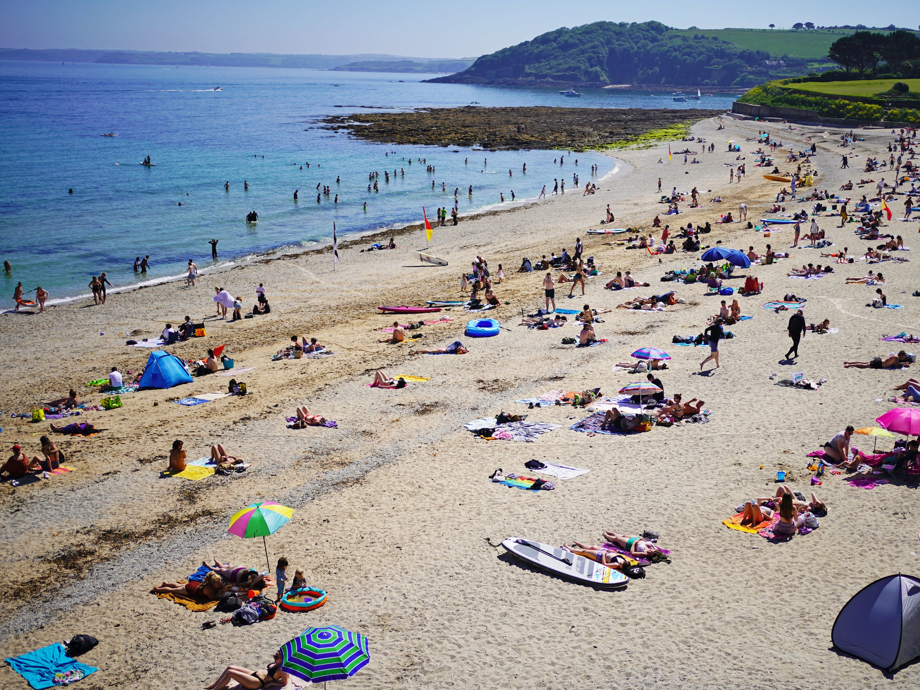 <p>Enjoying the sunshine on Gyllyngvase Beach near Falmouth in Cornwall</p>