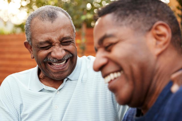 two men laughing together