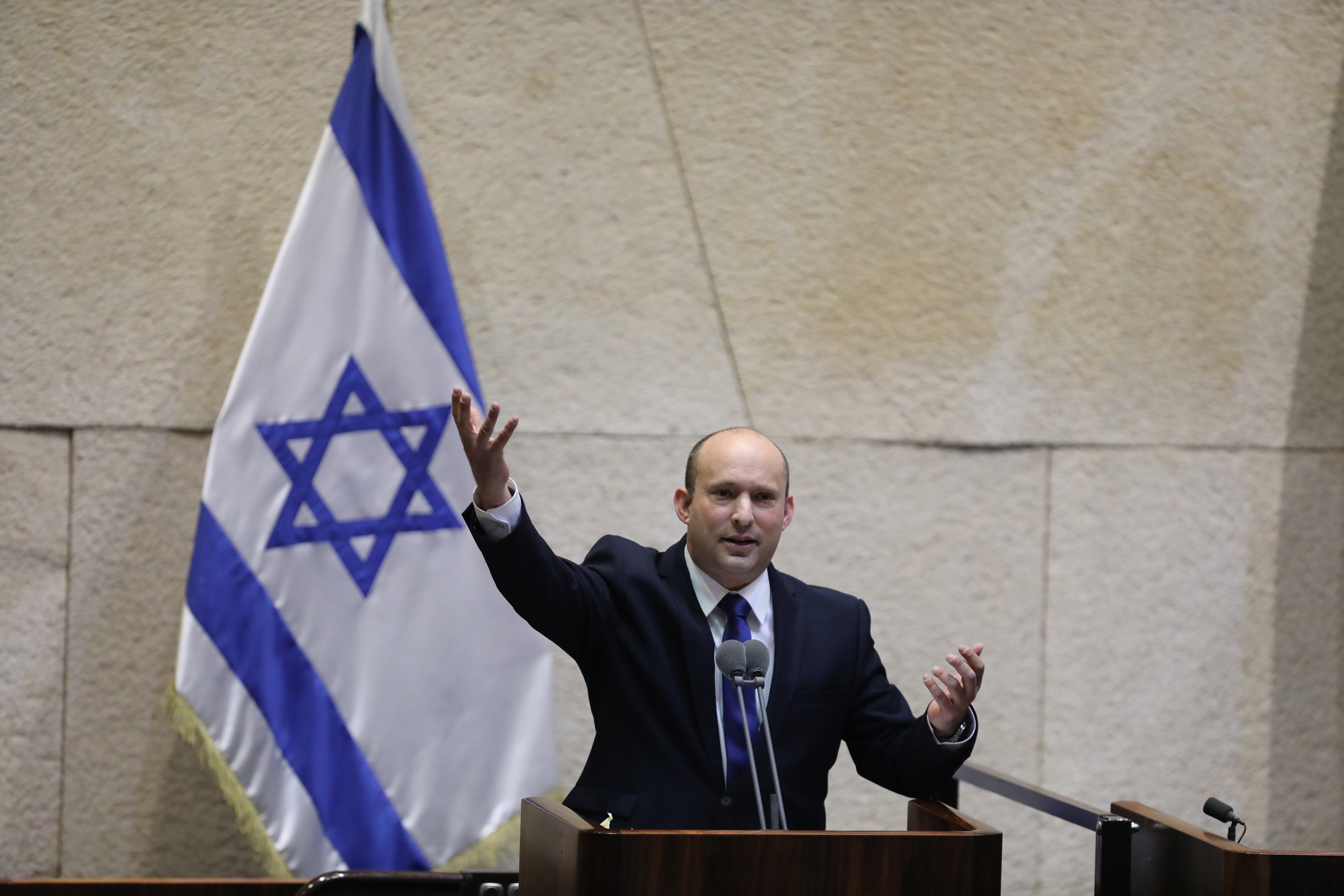 Naftali Bennett speaks during a special voting session on the formation of a new coalition government at the Knesset, the Israeli parliament