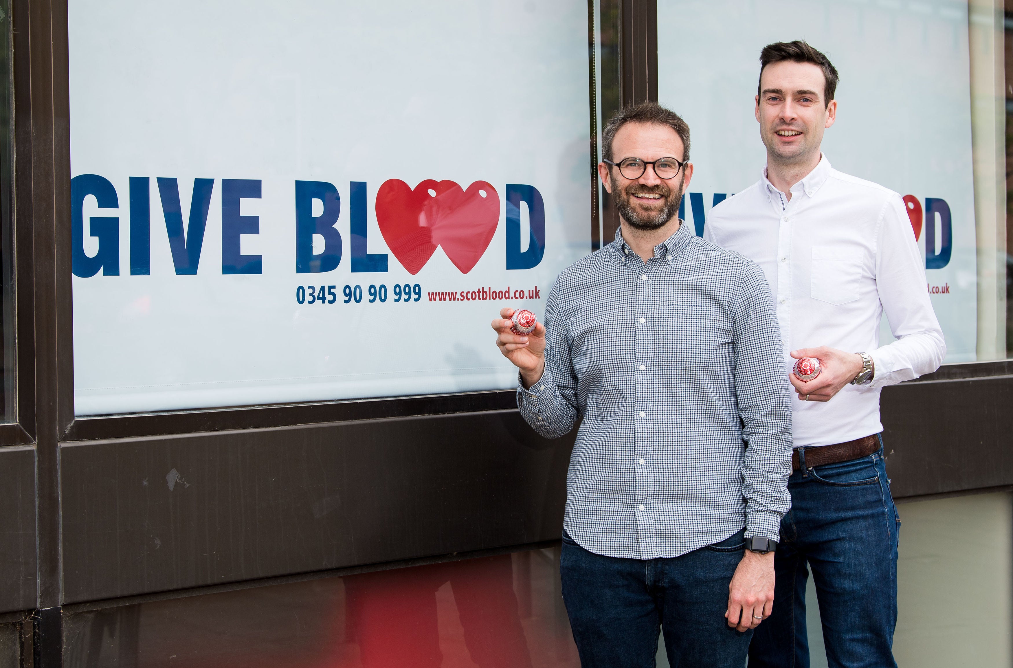 Married couple Steven Smillie and Tyler McNeil mark the changes to blood donation rules at Edinburgh Donor Centre in Scotland